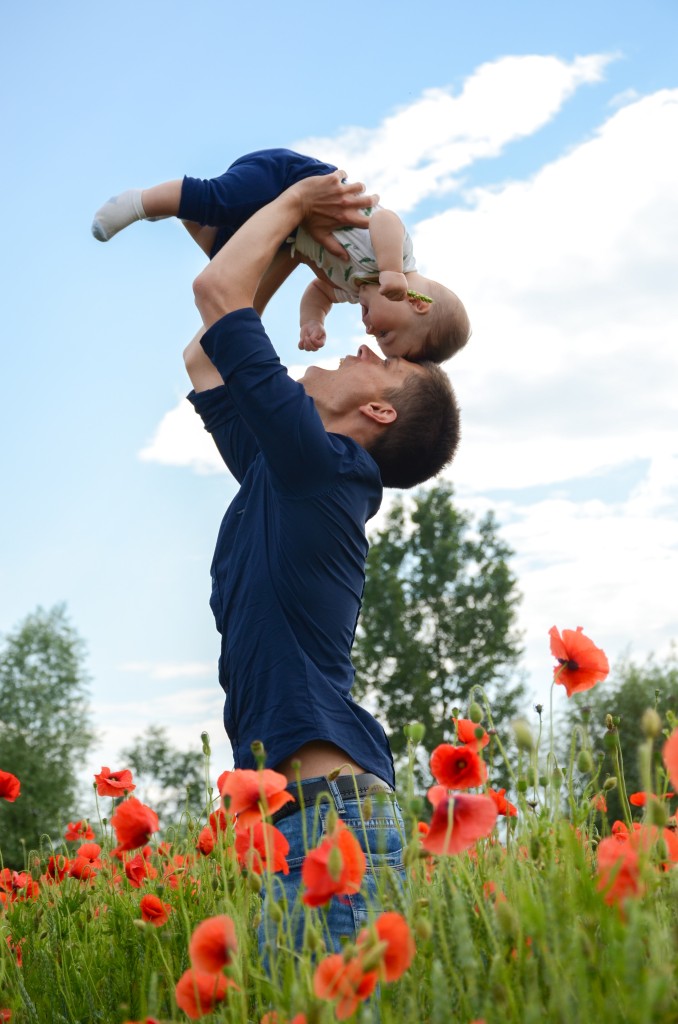 Dad Holding Baby Up High