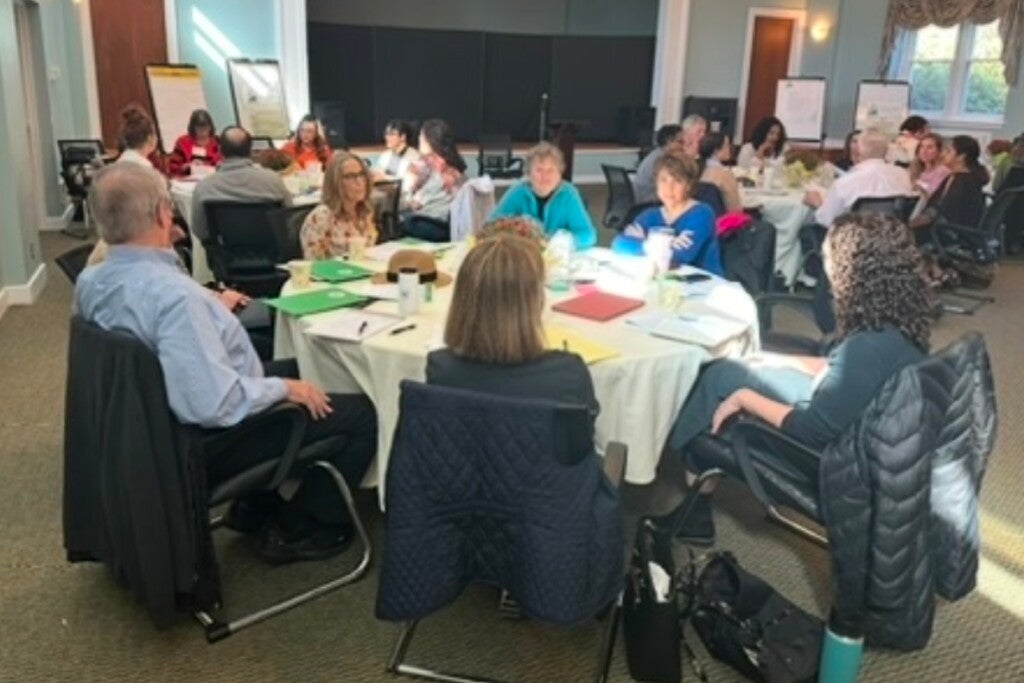 A meeting of CT 359 members seated around a table